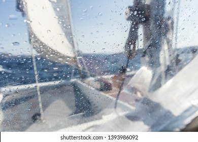 Sailing Yacht Catamaran Sailing In Rough Sea. Sailing. Sailboat Concept. Narrow Depth Of Field Image Focused On Water Drops On Splash Protective Canvas.