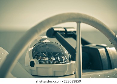 Sailing yacht control wheel and implement. Horizontal shot without people. Filtered.