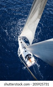 Sailing Yacht from mast at sunny day with deep blue ocean