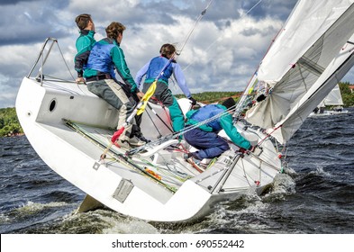 Sailing yacht race, regatta. Sailboat. Recreational Water Sports, Extreme Sport Action. Healthy Active Lifestyle. Summer Fun Adventure. Hobby. Gender Equality