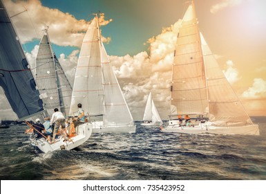 Sailing Yacht Race, Regatta. Sailboat. Recreational Water Sports, Extreme Sport Action. Healthy Active Lifestyle. Summer Fun Adventure. Team Athletes Participating In The Sailing Competition