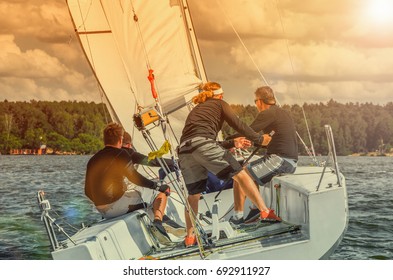 Sailing Yacht Race, Regatta. Team Athletes Participating In The Sailing Competition. Recreational Water Sports, Extreme Sport Action. Healthy Active Lifestyle. Summer Fun Adventure. Hobby.  