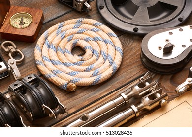 Sailing Yacht Rigging Equipment On Wooden Background 