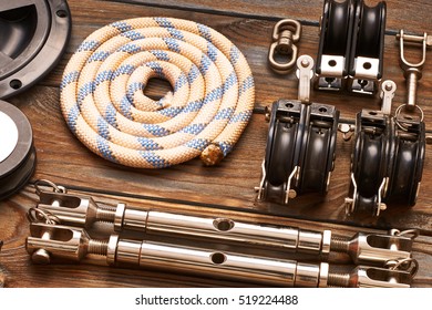 Sailing Yacht Rigging Equipment On Wooden Background 