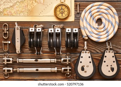 Sailing Yacht Rigging Equipment On Wooden Background 