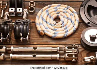 Sailing Yacht Rigging Equipment On Wooden Background 