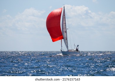 Sailing Yacht With Spinnaker On Open Water 