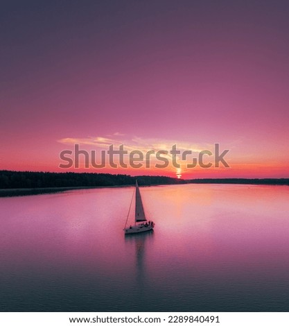 Sailing yacht in the sunset on the lake