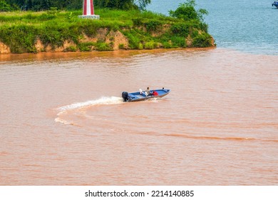 A Sailor Drives A Speedboat At The Confluence Of Two Rivers