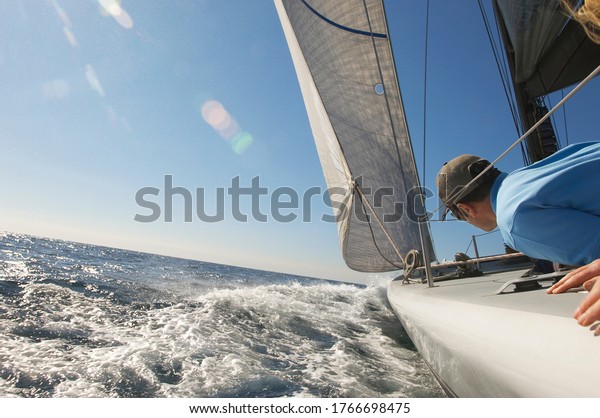 Sailor on yacht in\
ocean