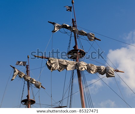 Sails and flags of a pirate ship