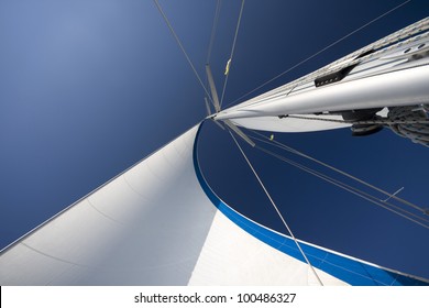 Sails and mast in the blue sky