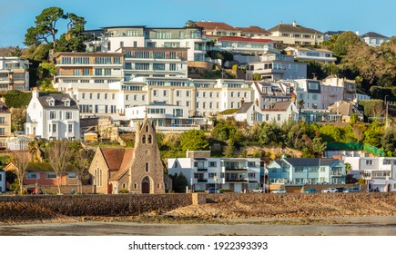 Saint Aubin town seashore view with Sacred heart of Jesus church,, bailiwick of Jersey, Channel Islands