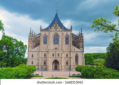 Saint Barbara's Church (Cathedral of St Barbara) Roman Catholic church Gothic style building facade in Kutna Hora historical Town Centre, green trees around, Central Bohemian Region, Czech Republic