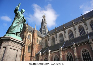 Saint Bavo Cathedral and statue of Laurens Janszoon Coster in the old town of Haarlem, Netherlands