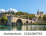 Saint Benezet bridge and Palace of the Popes in Avignon in a beautiful summer day, France