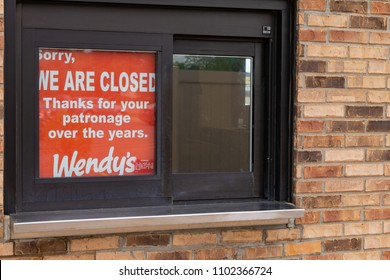 SAINT CLOUD, UNITED STATES - May 30 2018: The Drive Through Of A Closed Wendy's Restaurant Sits Abandoned With A Closure Sign.