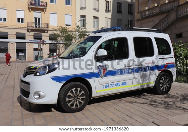 Saint Etienne, France - 05 08 2021 : Municipal\
police car in front of the town hall, town of Saint Etienne, Loire\
department, France