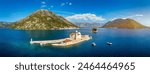 Saint George Island and Church of Our Lady of the Rocks in Perast, Montenegro. Our Lady of the Rock island and Church in Perast on shore of Boka Kotor bay (Boka Kotorska), Montenegro, Europe. 