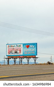 Saint George, UT, USA - January 2020 : Children's Dental Billboard On A Utah Country Road