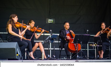 Saint Hubert, Canada - July 28 2019: Quartet Band Playing In The Parc De La Cité In Saint Hubert