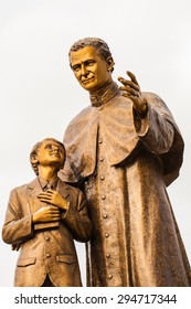 Saint John Bosco and Saint Dominic statue.