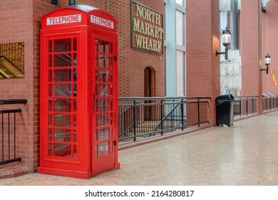 Saint John, NB, Canada - June 5, 2022: A red phone booth. The booth is the famous British K6 design, but without the crown at the top.