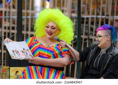 Saint John, NB, Canada - June 5, 2022: A drag queen and king read children's stories at the Drag Story Hour in Market Square. Focus on the queen.