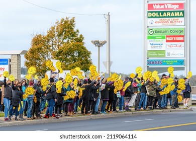 Saint John, NB, Canada - October 30, 2021: Striking Members Of CUPE (Canadian Union Of Public Employees) Line The Road To Wave At Traffic.