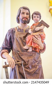 Saint Joseph the worker with Child Jesus catholic religious statue