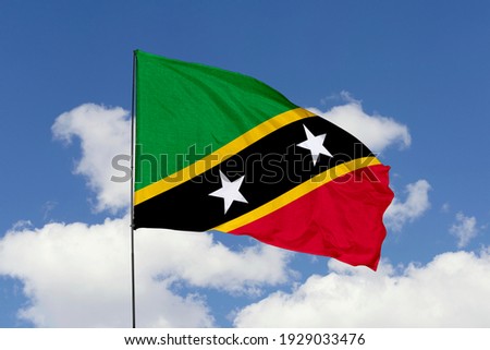 Saint Kitts and Nevis flag isolated on sky background with clipping path. close up waving flag of Saint Kitts and Nevis. flag symbols of Saint Kitts and Nevis.