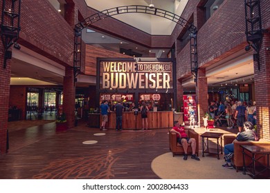 Saint Louis, MO—July 3, 2021; visitors wait in the lobby of the anheuser busch brewery tour center at the Budweiser facility in the Soulard District.