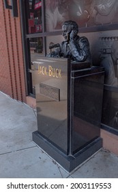 Saint Louis, MO—July 5, 2021; Bronze Bust Of Sports Caster Joe Buck With Microphone Sits Outside Busch Stadium To Honor The Former Cardinals Baseball Announcer.