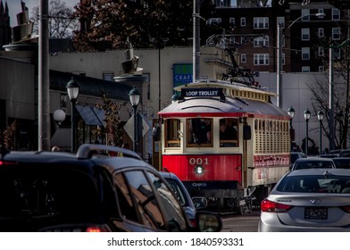 Saint Louis, MO--Nov 23, 2018; Red And Yellow Antique Street Car Trolley Moves Through University City Shopping District On Delmar Blvd.