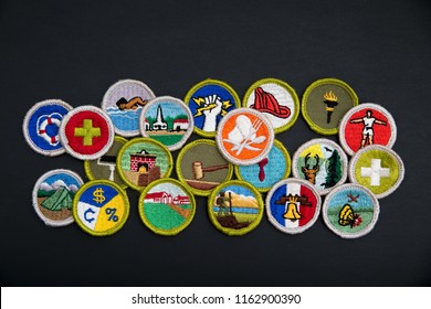 SAINT LOUIS, UNITED STATES - AUG 22, 2018:  Group Of Boy Scouts Of America (BSA) Merit Badges On Black Background