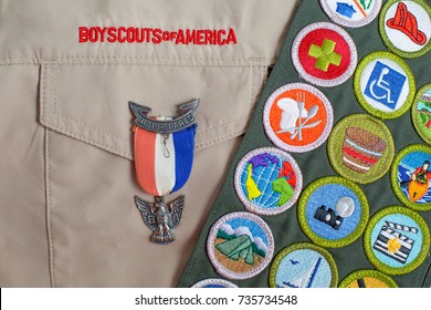 SAINT LOUIS, UNITED STATES - OCTOBER 16, 2017:  Eagle Pin And Merit Badge Sash On Boy Scouts Of America Uniform