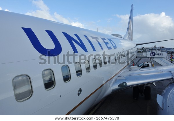 SAINT MARTIN,\
DUTCH ANTILLES -8 FEB 2020- An airplane from United Airlines (UA)\
at the gate at the Princess Juliana International Airport in Saint\
Martin (Sint Maarten).