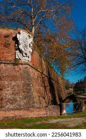 Saint Mary Bulwark of Lucca ancient walls with moat and autumnal leaves - Shutterstock ID 2256041983