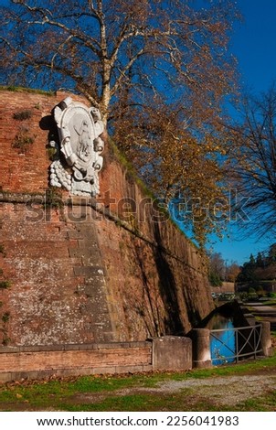 Saint Mary Bulwark of Lucca ancient walls with moat and autumnal leaves