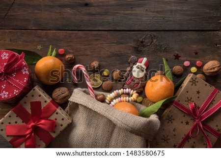 Saint Nicholas background with gifts, sweet candy, Chocolate and place for text