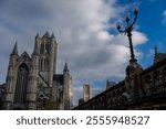 Saint Nicholas Church. Ghent, Flemish Region, Belgium. At the back, Saint Bavo’s cathedral Ghent.