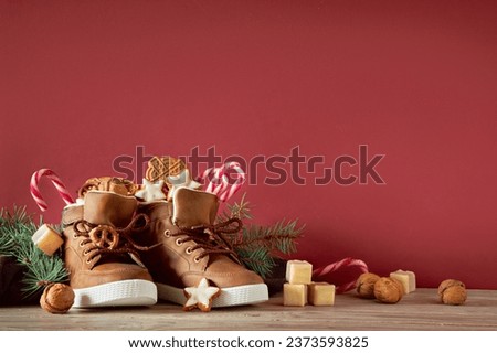 Saint Nicholas Day or Nikolaus, german holiday, December 6. Children shoes with traditional sweets.
