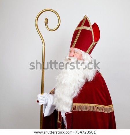 Saint Nicholas with mitre ans staff in profile on white