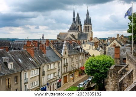 The Saint Nicolas church and the roofs of historic Old town of Blois city, France