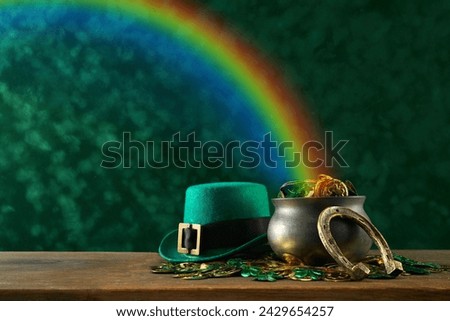 Saint Patrick's Day background. Black pot full of gold coins and leprechaun hat