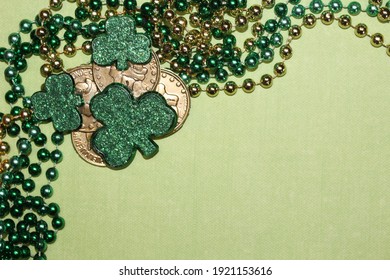 Saint Patrick's Day Banner Design with Beads Shamrocks and Gold Coins Border St. Patty's Sales Announcements, Advertisements, Holiday Cards.  Framed Flat Lay with Green Background and Copyspace Party  - Powered by Shutterstock