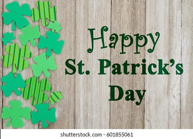 Saint Patrick's Day Greeting, Green Shamrocks On Weathered Wood With Text Happy St Patrick's Day