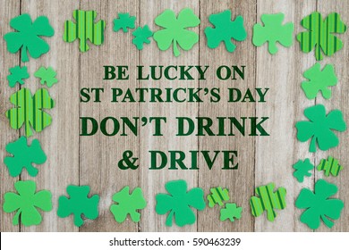 Saint Patrick's Day Safety Message, Green Shamrocks On Weathered Wood With Text Be Lucky On St Patrick's Day Don't Drink And Drive