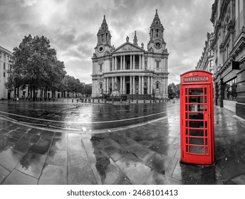 Saint Paul's cathedral and red telephone box on rainy day in London. England - Powered by Shutterstock