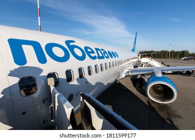 Saint Peterburg, Russia / 2020.08.14 / People Queuing To Board The Airline Plane Pobeda